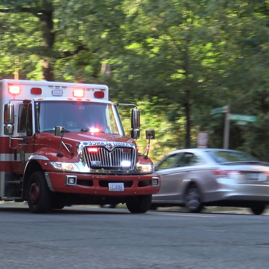 Emergency ambulance responding with lights on